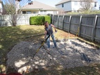 Putting gravel on top of the landscaping cloth
