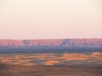 near Merzouga - Saharan sunset - Erg Chebbi dunes in foreground - the ridge is the Algerian border